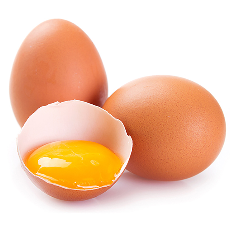 Three eggs, one broken in half showing yolk