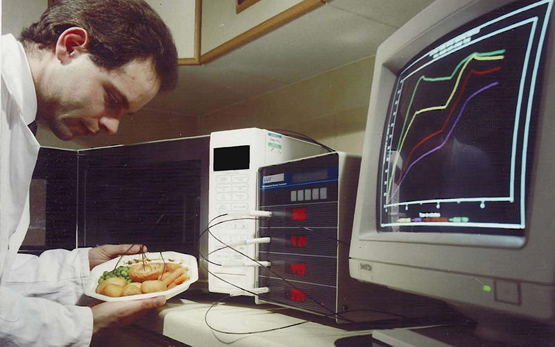 Scientist testing microwave processing technologies