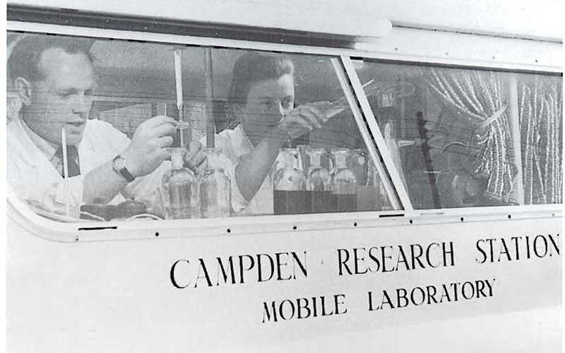 Scientists performing tests in mobile laboratory