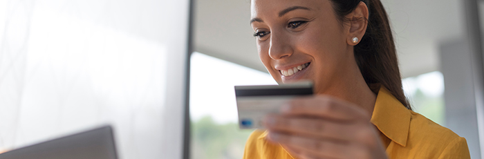 Woman making a purchase online using a credit card