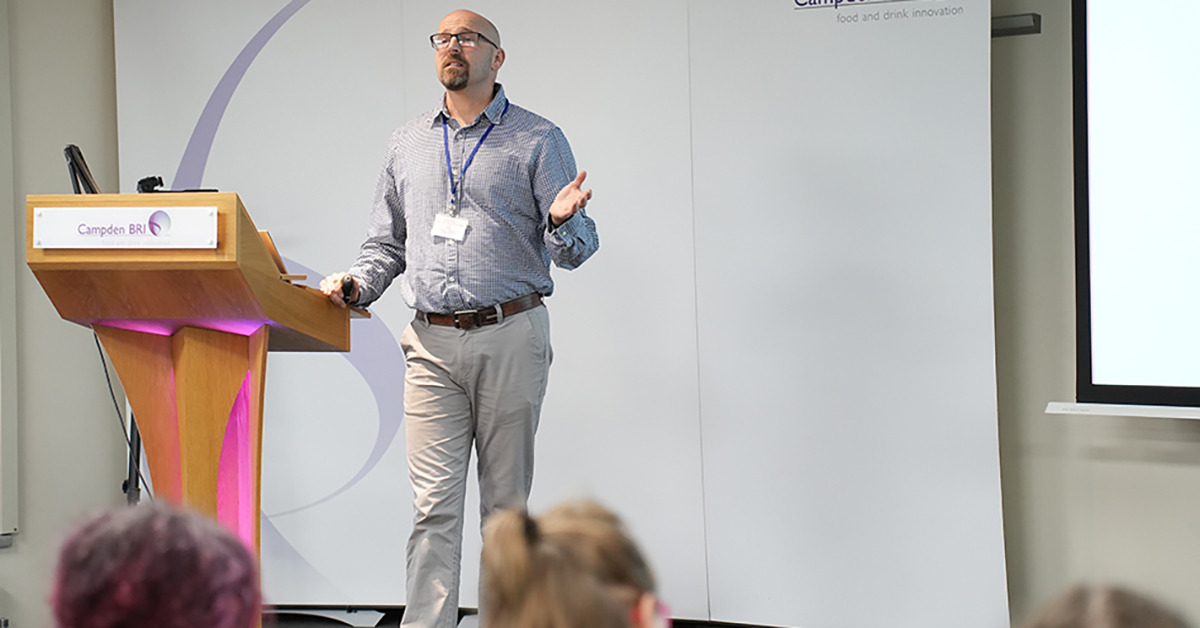 Mark Riley on stage presenting at the Brewers' Day 2025 event held at Campden BRI